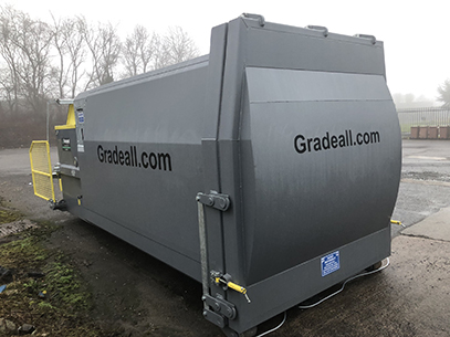 Gradeall GPC P24 self-cleaning portable wet waste compactor with safety bin lift mechanism in a grey finish.