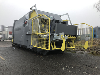 Gradeall GPC P24 portable wet waste compactor with bin lifter, in grey, at a bakery facility