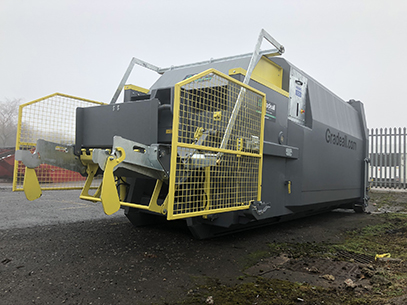 Gradeall GPC P24 portable wet waste compactor with yellow bin lift at Aulds Bakery, showcasing efficient waste handling