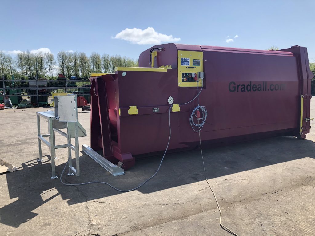 The Gradeall GPC P24 portable wet waste compactor with manual load feature, hydraulically operated lid, and remote control panel in a vandal-proof enclosure