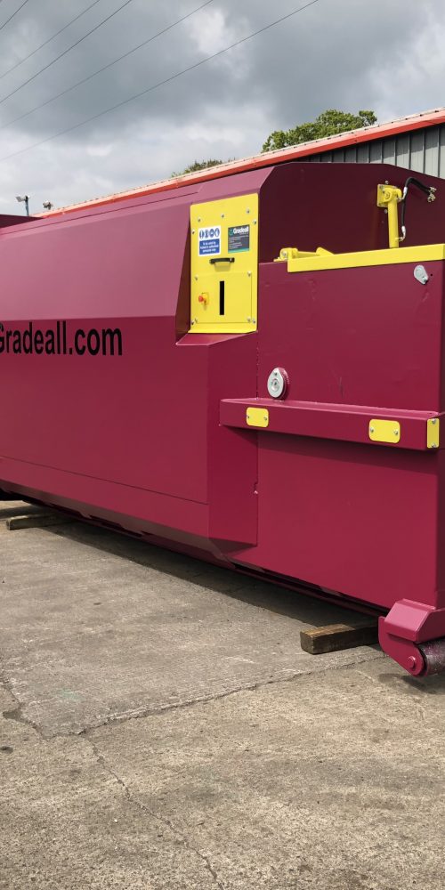 The Gradeall GPC P24 portable wet waste compactor with a vibrant purple finish, showcasing its odor-reducing rubber seal and water-resistant design