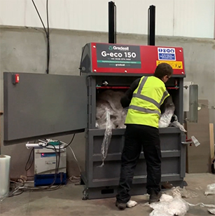 Loading plastic into Gradeall G eco 150