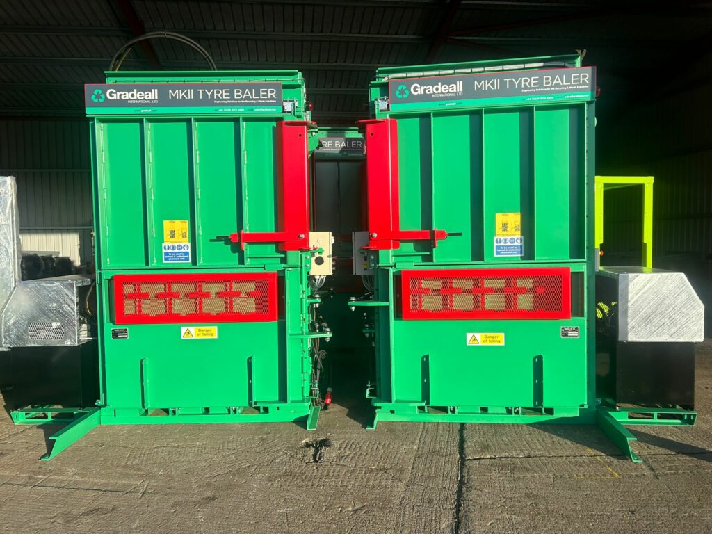 Two new Gradeall MKII tyre balers side by side, ready for dispatch at the gradeall factory.