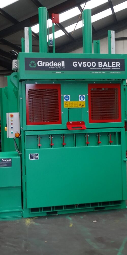 Gradeall GV-500 baler machine standing in an industrial facility.