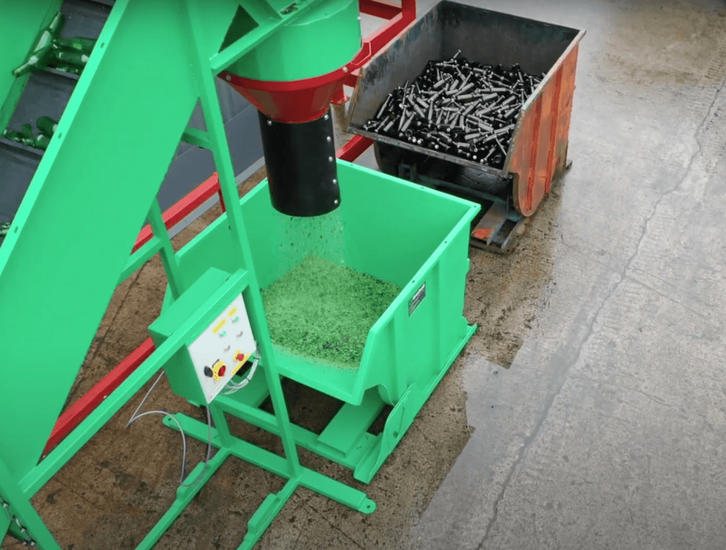 Glass pulverizer machine smashing glass bottles into cullet for recycling