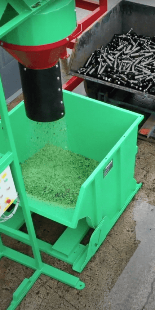 Glass pulverizer machine smashing glass bottles into cullet for recycling